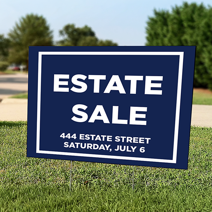 A navy blue yard sign with the words 'Estate sale' on it along with address information and the date of the sale